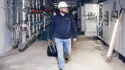 Marco Krause stands in New Building H on the campus of Kaiserslautern University of Applied Sciences.