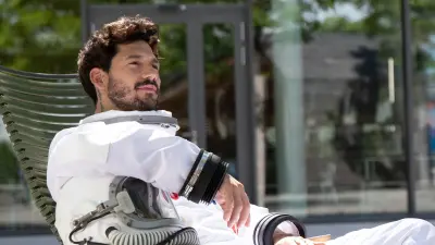 Datanaut resting their arm on their helmet as visualization of backing up building data with Building Data Lakes