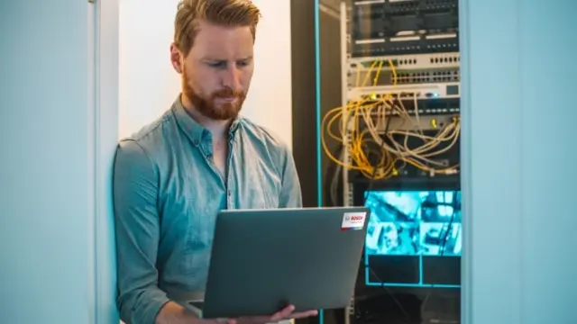 IT expert checking building automation systems