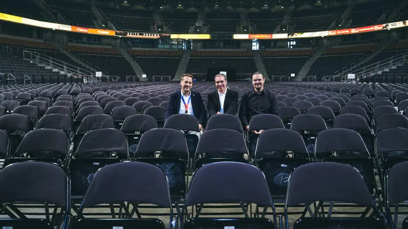 Interior photo of the Arena with Bosch and Arena employees
