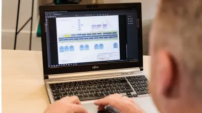 Bernard Gijzen works on technical schematics at his laptop