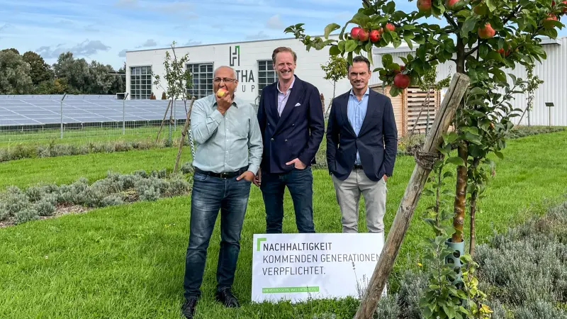 HÄRTHA Group, CEO Sven Killmer, outside company building next to an apple tree