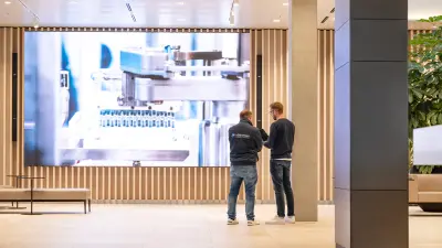 Markus Steurer and Florian Thunitgut from Hörburger in the lobby of Vetter Pharma, interior view