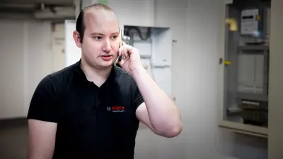 Service technician Kevin Wilhelm on the phone with a customer