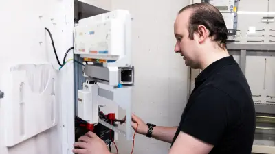 Service technician carrying out maintenance on a customer’s system