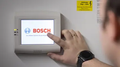 Service technician Kevin Wilhelm at a Bosch security terminal