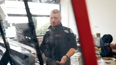 Bosch Building Automation employees digitally testing control cabinet elements