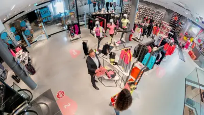 Scene in clothing store, ceiling camera captures with wide angle