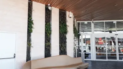 The entrance of the shopping mall and the there integrated cameras.