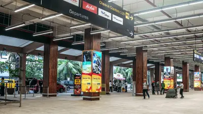 Asian travelers walking across the terminal