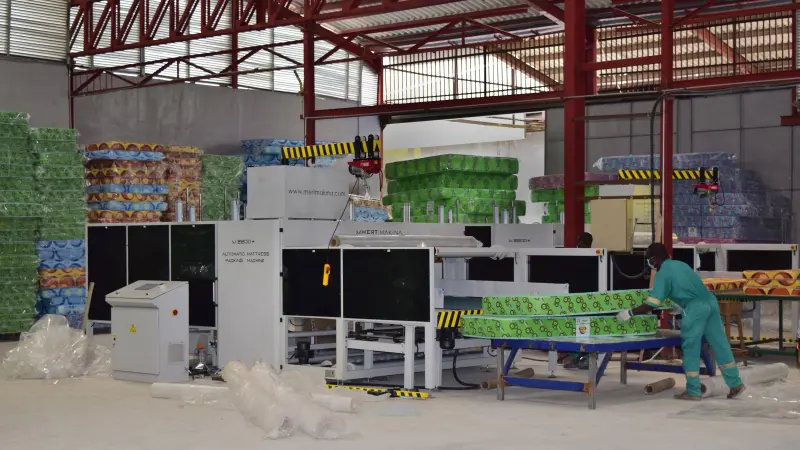 man working on a packaging machine