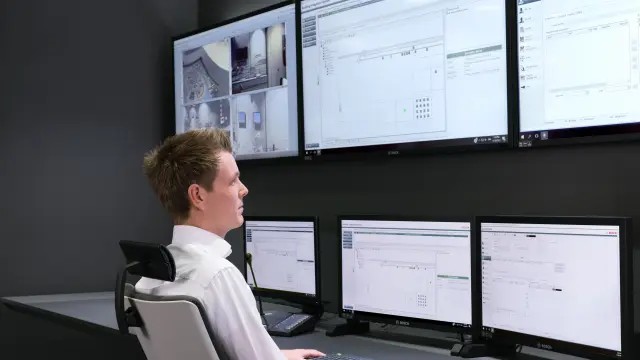 Security guards checking camera footages in control room