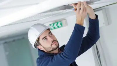  A man performing installation work.