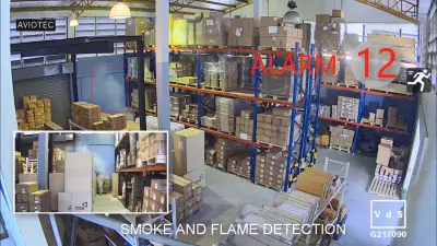 Fire alarm in a warehouse full with shelves and goods