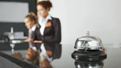 Hotel reception with two employees
