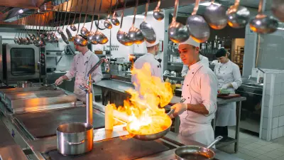 Hotel kitchen with several cooks