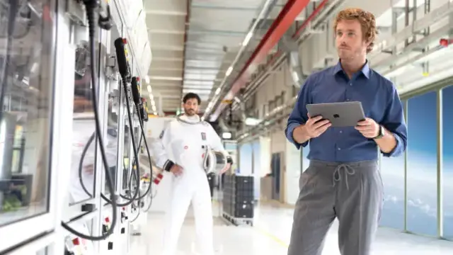 A technician for fire alarm systems is on-site and has all the information on his tablet for targeted services