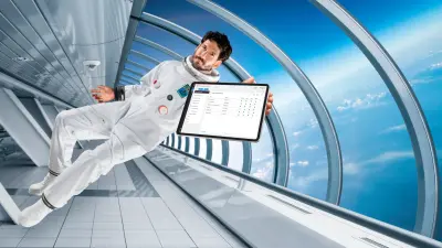 Astronaut with tablet in space station