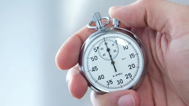hand with stopwatch
